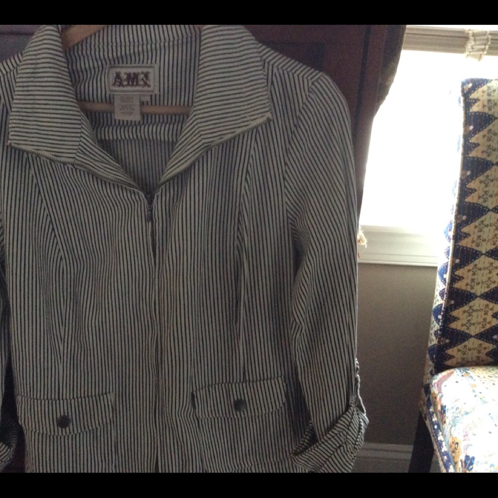 Cotton, zipper front jacket with black stripe.